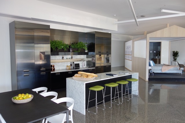 Black stainless Italian-made kitchen with marble island