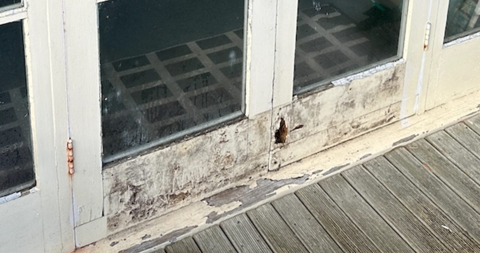 Before — rotted door sill needing timber repair