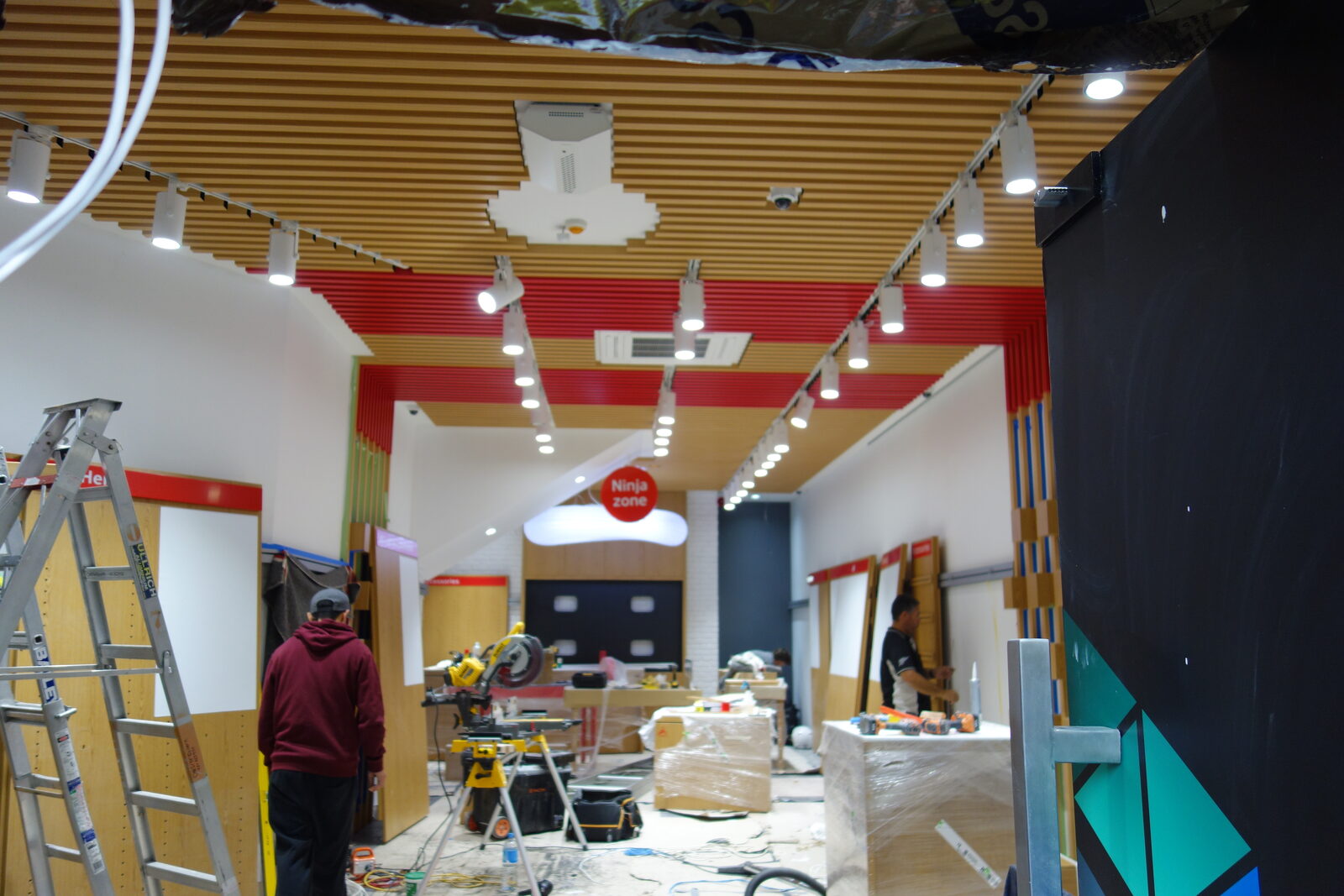 Vodafone store shopfit — ceiling battens, wall panelling and display joinery by OnsiteJoiner